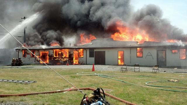 Advanced fire conditions at a fully-involved building during a recent live fire training exercise.