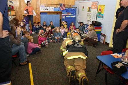 Showing students what a firefighter would look like and sound like in a smoke-filled environment.