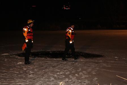 Crews learning and practicing ice rescue strategies and tactics.