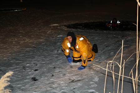 Crews learning and practicing ice rescue strategies and tactics.