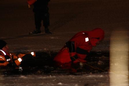 Crews learning and practicing ice rescue strategies and tactics.