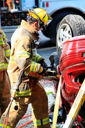 A firefighter practices vehicle extrication during a recent Open House.